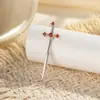 Nuevos Pendientes de Hueso de Oreja de Hensen con Forma de Cruz de Espada de Circonita Micro-Pavimentada con Tornillo Pendientes Perforados de Pareja de Gama Alta