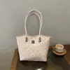 Bolso de hombro y bolso de mano versátil transfronterizo para el día a día, nuevo otoño 2026, bolso tote de lunares negros, bolso grande de capacidad para mujer