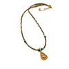 Collar Colgante de Calabaza Dorada Hueca con Zirconia de Arena de Ojo de Tigre Facetado de Partículas Pequeñas Accesorios de Cadena Elegante para Suéter Femenino
