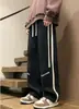 Nuevos pantalones casuales de otoño e invierno para hombre, marca de tendencia estilo americano, pantalones holgados de pierna recta, pantalones largos deportivos versátiles de pierna ancha, ropa para hombre