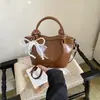 Bolsa feminina de ombro único e transversal, popular e com temperamento, nova, estilosa, simples para o dia a dia, para o verão de 2026, com textura