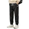 Pantalones casuales para hombre 2025 nuevo estilo pantalones de chándal marca de moda holgados pantalones deportivos jogger con puños ajustables por cordón para hombre