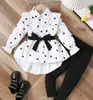 Roupas Infantis 2025 Transfronteiriças Primavera e Outono Novo Estilo Moda Feminina Vestido Camisa Longo com Cinto e Conjunto de Leggings