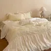 Estilo romántico francés femenino Tencel de algodón ultra suave con volantes y encaje color crema juego de ropa de cama casual de cuatro piezas