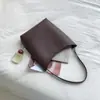 Bolso tipo cubo de cuero PU de gran capacidad minimalista estilo coreano, un artículo de moda transfronterizo de alta gama y único, perfecto para ir al trabajo y el uso diario, un bolso de hombro tote para mujer