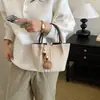 Bolso tote de tela cepillada transfronterizo para mujer, nuevo modelo 2026, bolso de hombro o axila de nicho vintage de alta calidad