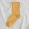 Calcetines de oreja de madera para mujer encaje color liso longitud media pantorrilla calcetines nuevo estilo coreano calcetines casuales de algodón para mujer calcetines de felpa lindos otoño e invierno