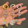 Llavero Creativo de Acrílico y Resina con Forma de Corazón Colgante para Teléfono Móvil Lindo Unicornio Mochila de Acrílico Accesorios Pequeños