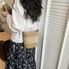 Bolso de mano tejido de moda para primavera para mujer 2026 Nuevo estilo Bolso casual para vacaciones en la playa Bolso cubo cruzado simple y versátil