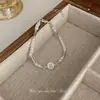Estilo francés lujo ligero simple Pulsera de imitación de perla Tulipán costura versátil nuevo diseño de alta calidad exquisita pulsera para mujer