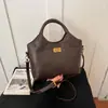 Bolso Cubo Retro Shuai Mi Jia para Mujer 2026 Nuevo Bolso de Mano con Patrón de Diamantes Moda de Nicho Bolso de Hombro Único Cruzado