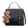 Yaozi 2026 principios de otoño nueva moda mochila simple para mujer bolsa escolar para estudiante bolso de hombro cruzado versátil y elegante