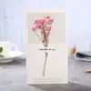 Tarjeta de felicitación con flores secas al por mayor Barato Regalo pequeño de vacaciones Cumpleaños Postal universal Gama alta Ins