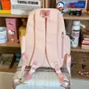 Mochila escolar impresa de colores muy elegante, bolsa casual de doble hombro fresca y linda, mochila ligera de gran capacidad