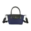 Nuevo bolso mini de patchwork de nailon de alta gama 2026 para mujer, bolso de mano de hombro cruzado moderno y versátil, bolsa de regalo