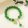 [Venta al por mayor directa de fábrica] Nuevo estilo chino Imitación Jade Dongling Puesto de Exhibición de Feria de Templo del Mercado Nocturno Pulsera de Vidrio Joyería Más Vendido