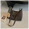 Bolsa grande de couro macio vintage para o dia a dia, de alta qualidade, para mulheres, nova moda 2026, versão coreana, bolsa simples de ombro e transversal