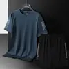 2215 Conjunto Estilo Nueva Pareja Transpirable Seda de Hielo Camiseta de Manga Corta para Hombre Venta al por Mayor Casual Tallas Grandes Unisex Conjunto Venta Caliente