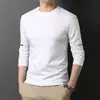 Camiseta de manga larga para hombre de color liso Sorona, versátil, corte holgado, cuello redondo, para primavera y otoño, top casual moderno