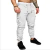 2023 Comércio Exterior Transfronteiriço Novos Calças Casuais de Trabalho Masculinas Estilo Coreano Juvenil Cor Sólida Simples Multi-bolsos Calças de Cano Curto