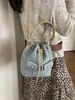 Bolso cubo liso de color para mujer, importado, nuevo modelo 2026, bolso de mano con cordón, elegante, moderno, de un solo hombro, cruzado