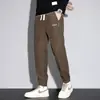 Pantalones casuales ajustados cónicos de forro polar Boao para otoño e invierno con puños elegantes
