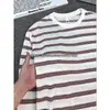 Camiseta de manga larga a rayas rojas y blancas estilo americano, unisex, corte holgado y relajado, perfecta para otoño, creando un look elegante y cómodo como capa base