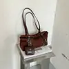 Bolsa Retro Simple para Mujer Shuai Mi Jia 2026 Nueva Bolso Cruzado para el Trabajo Bolso de Hombro a la Axila de Moda Bolso Baguette