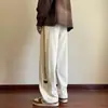 Pantalones casuales de otoño para hombre, recién llegados, estilo Hong Kong, modernos, holgados, de talla grande, con pierna recta, pantalones anchos a rayas a la moda para estudiantes.