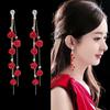 Pendientes de lazo de terciopelo rojo con ambiente de moda, temperamento femenino, flor dulce, borla larga, pendientes Joker al por mayor