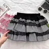 Saia de Bolo Fofa Sexy de Renda com Retalhos Xadrez para Primavera e Verão Feminina de Cintura Alta Linha A Curta