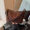 Bolsa de ombro casual retrô transfronteiriça para mulheres, nova moda outono 2026, bolsa de mão moderna, bolsa transversal versátil para o dia a dia
