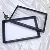 Caja de Anillos Totalmente Negra con 100 Ranuras para Almacenamiento y Decoración de Aretes, con Tapa y Soporte de Exhibición, Empaque de Joyería Apilable