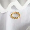 Anillo de Oro de 18K con Enlace de Tejido Hueco Cruzado Anillo Geométrico Hueco de Acero de Titanio Moda Europea y Americana