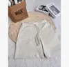 Shorts Esportivos Casuais Americanos Novos de Verão 2026 para Mulheres Estilosos de Cintura Alta Emagrecedores de Perna Larga Comprimento Médio