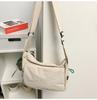 Bolsa Transversal Estilo Japonês Estilo Coreano Sem Estampa Feminina Chegada Nova Outono 2024 Bolsa Escolar Leve Nylon para Deslocamento Casual Bolsa de Ombro