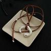 Collar de Cuerda de Cuero Marrón Nuevo para Primavera y Verano Corea del Sur Colgante Abstracto de Cuerpo Humano Plata Cadena de Lana Cadena para Clavícula de Lujo Ligero de Nicho