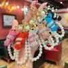Accesorio de llavero de cadena de perlas hecho a mano con langosta de pedrería de arcilla creativa, colgante para bolso de pareja, sensación de alta gama, al por mayor