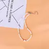 Gargantilha simples europeia e americana com contas de arroz branco e concha, corrente branca para pescoço da moda feminina, atacado
