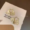 Pendientes de anillo liso exagerado con aguja de plata S925 de estilo europeo y americano para mujer, pendientes de temperamento simple Joker de lujo ligero de alta gama, venta al por mayor