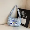Bolsa de hombro de dibujos animados a cuadros linda de gran capacidad, nueva bolsa de lona versátil para estudiantes, bolso cruzado, bolso popular para commuting, bolso con forma de dumpling
