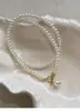 Pérola de vidro cobre micro embutido zircão otbuckle colar luz de luxo nicho design Pérola brilhante vento frio clavícula cadeia feminina