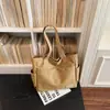 Bolsa de Lona Estética de Alto Valor para Mulheres, Grande Capacidade, Bolsa de Ombro para Estudantes, Bolsa de Mão Portátil, Novo Estilo Tendência Primavera/Verão 2026
