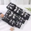 Venta al por mayor de cajas de regalo negras de alta gama con tapa y base, con un lazo decorativo, adecuadas para recuerdos y regalos; Cajas de regalo personalizadas disponibles