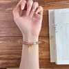 Pulsera de Cristal de Fresa Natural de Círculo Único para Mujer con Piedra Lunar Gris y Dijes de Campana Dorada Antigua Joyería