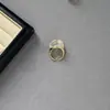 Pendientes y anillo de diseño único en espiral blancos transparentes para mujer, lujo ligero con un toque de alta gama, pendientes de botón y accesorios de anillo de luna creciente morada