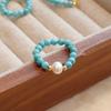 Anillo turquesa pequeño de magnesita anillo elástico femenino nicho retro anillo de perla roja del sur anillo de cera de abeja pulsera al por mayor