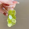 Pendientes de borla de flor de cuentas de color dopamina para primavera, sensación de lujo ligero y alta gama, pendientes atmosféricos estilo vacacional para mujer