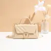 Bolsos de mujer Guangzhou al por mayor 2025 nuevo estilo de moda bolso pequeño de cadena bolso pequeño de PU de alta textura bandolera de hombro
