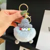 Llavero de haba pequeña de pelo sintético colgante de felpa hecho a mano llavero de alto valor de color llavero diy regalo de nicho elfo
